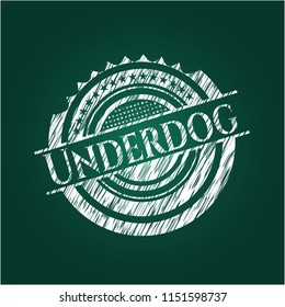 Underdog chalk emblem written on a blackboard