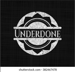 Underdone written on a chalkboard