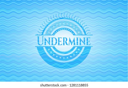 Undermine light blue water wave style badge.