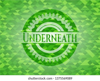 Underneath green emblem with triangle mosaic background
