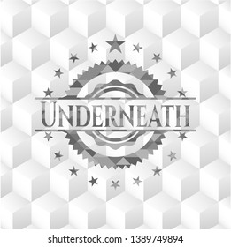 Underneath grey emblem with geometric cube white background