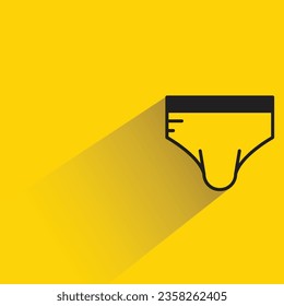 underpants with shadow on yellow background