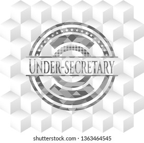 Under-secretary realistic grey emblem with cube white background