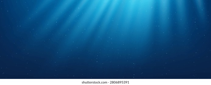 Underwater blue ocean background with light rays shining through water surface. Sunlight beams penetrating deep sea with floating particles. Marine texture for graphic design concept.