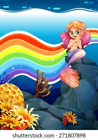 Underwater scene with mermaid and rainbow