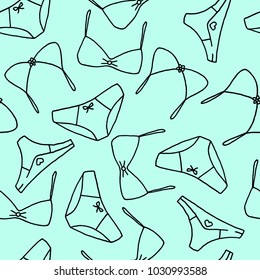Underwear in a seamless pattern. Blue, green background and black outlines drawing of panties and bras in endless pattern. 
