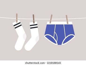 Underwear and socks pinned with clothespins to a cord drying outside svg