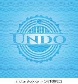 Undo light blue water wave emblem background. Vector Illustration. Detailed.