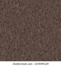 Uneven mottled pattern, in brown tones and with small black spots. Abstract bark texture. Textile design.