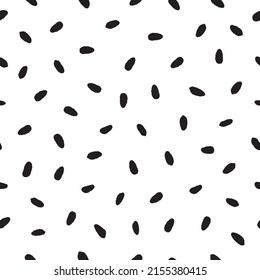 Uneven oval specks pattern in black and white. 