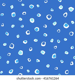 Uneven specks, spots, blobs seamless pattern. Free hand drawn speckles, flecks, stains or dots of different size texture. Abstract background. Shades of blue.