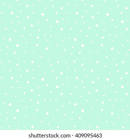 Uneven specks, spots, blobs, splashes seamless pattern. Free hand drawn rough speckles, flecks, stains or dots of different size texture. Abstract white and mint green background.