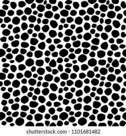 Uneven spots, spots, pebbles of different size. Seamless pattern. Abstract  dotted texture background.