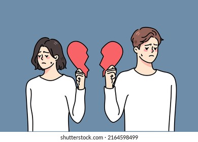 Unhappy couple holding pieces of broken heart suffer from breakup or divorce. Sad upset man and woman struggle with split or separation. Relationships over. Vector illustration. 