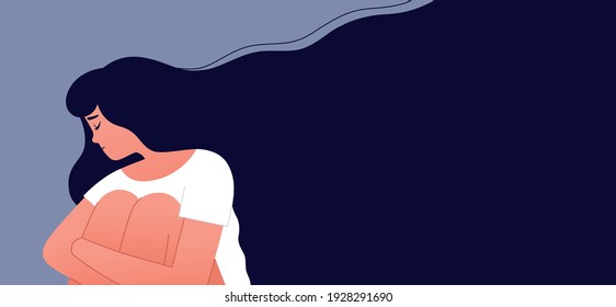 Unhappy girl sitting and hugging her knees in the corner. Sad lonely woman in depression with flying hair. Depressed person. Man under stress concept