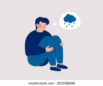 Unhappy man hugs his knees and sits on the floor with rainy cloud above his. Sad boy is crying.  Male character feels depression, sorrow, grief. Mental disorder or illness concept. Vector illustration