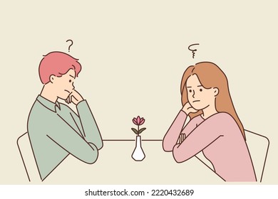 Unhappy man and woman sit at table in restaurant at first date feeling confused and stressed. Frustrated couple at cafe have fight or disagreement. Vector illustration. 