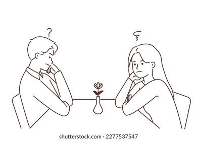 Unhappy man and woman sit at table in restaurant at first date feeling confused and stressed. Frustrated couple at cafe have fight or disagreement. Vector illustration. 