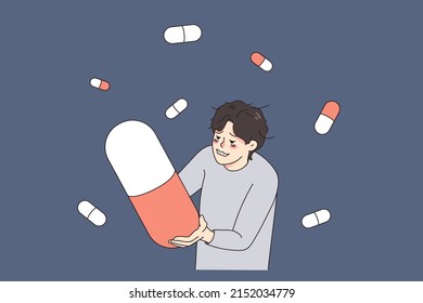 Unhappy stressed man suffer from drug addiction hold huge pill. Upset unhealthy guy struggle with depression addicted to medication and tablets. Medicine and healthcare. Vector illustration. 