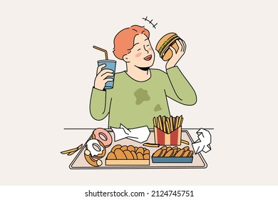 Unhealthy eating in childhood concept. Smiling cheerful fatty boy sitting and eating hamburger donuts french fries drinking lemonade enjoying junk food vector illustration 