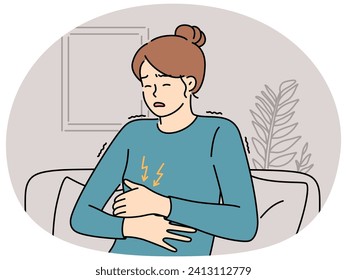 Unhealthy woman sit on couch suffer from stomachache. Unwell female struggle with abdominal pain or cramps. Healthcare. Vector illustration.