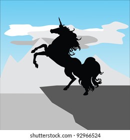 Unicorn on a ledge against hills