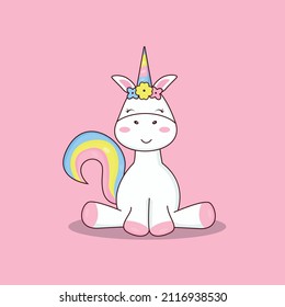 A unicorn sits with a rainbow tail