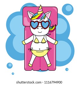 unicorn with sunglasses and bikini sunbathing on a beach mattress