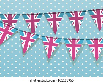 Union jack bunting on a blue polka dot background