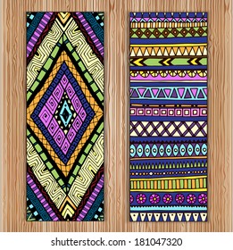 Unique abstract  hand drawn ethnic pattern card set with geometric elements on the wood background. EPS10 organized in groups for easy editing.