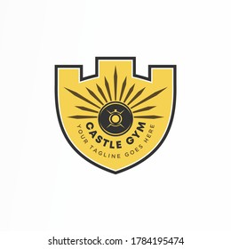 Unique castle or fortress icon and barbell in shield or guard image graphic icon logo design abstract concept vector stock. can be used as a corporate identity associated with gym or sport