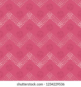 Unique hand drawn dotted chevron with polka dots seamless vector pattern in pinks and plum. Great for fashion, textiles, product packaging, beauty, home decor, stationery and graphic design uses.