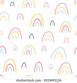 Unique hand drawn rainbow texture. Rainbow seamless pattern. Cute kids nursery background in pastel colors. Baby shower decoration. Lovely cartoon rainbows for wallpaper. Vector illustration.