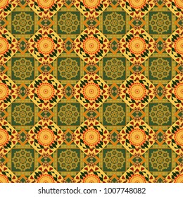 Unique kaleidoscope design. Multicolor mosaic texture. Seamless texture in green, orange and yellow colors. Abstract kaleidoscope background. Beautiful vector kaleidoscope seamless pattern.