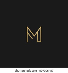 Unique modern creative elegant geometric fashion brands black and gold color M initial based letter icon logo.