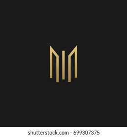 Unique modern creative stylish geometric real estate  black and gold color M initial based letter icon logo.