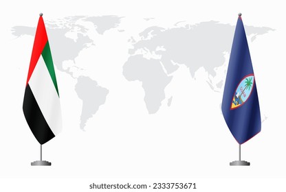 Emiratos Árabes Unidos y banderas de Guam para una reunión oficial contra el fondo del mapa mundial.