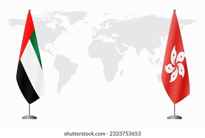 United Arab Emirates and Hong Kong flags for official meeting against background of world map.