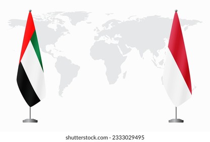 United Arab Emirates and Monaco flags for official meeting against background of world map.