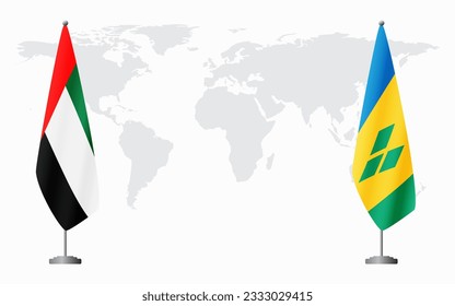 United Arab Emirates and Saint Vincent and the Grenadines flags for official meeting against background of world map.