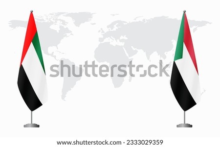 United Arab Emirates and Sudan flags for official meeting against background of world map.