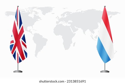 United Kingdom and Luxembourg flags for official meeting against background of world map.