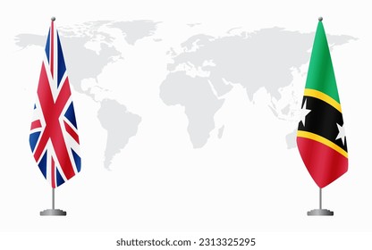United Kingdom and Saint Kitts and Nevis flags for official meeting against background of world map.