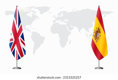 United Kingdom and Spain flags for official meeting against background of world map.