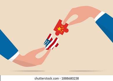 United States and China trade war negotiation, globalization deal between world leading country concept, businessman leader holding jigsaw with China and US flag to put it together. 