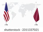 United States and Qatar flags for official meeting against background of world map.
