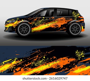 Universal design of car wrap for van in racing style. Set of graphic abstract orange, yellow and black stripes and paint splashes on dark blue background for car, rally, racing car.