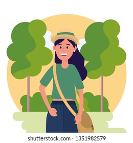 university woman wearing hat and trees with bushes