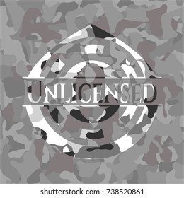 Unlicensed written on a grey camouflage texture