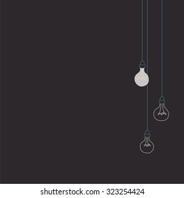 Unlit lightbulbs with one bulb illuminated